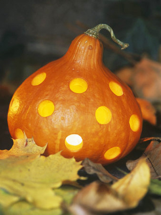 Hollowed Out Pumpkin with Holes and Light Inside